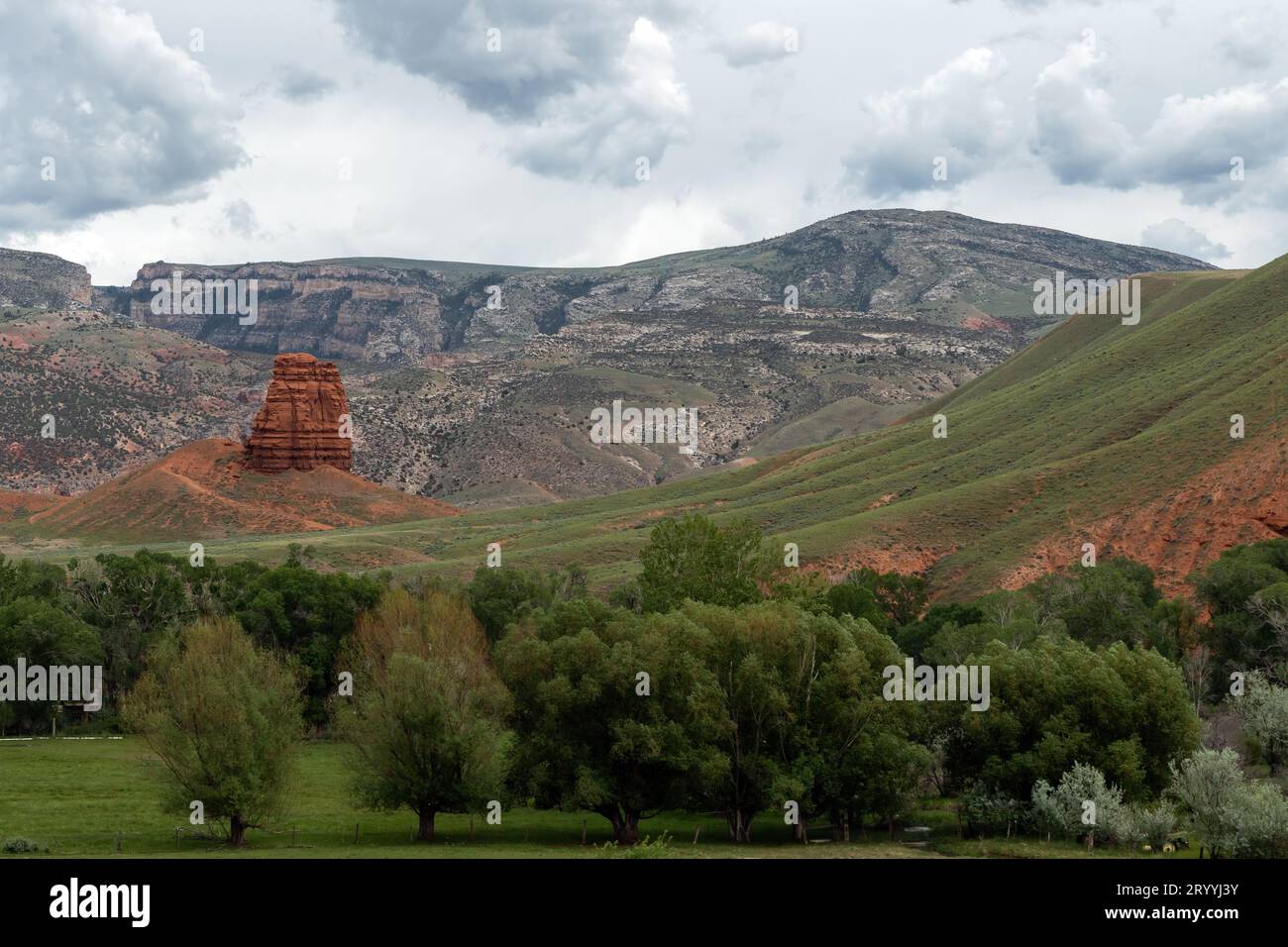 Chimney Rock along Highway 14 a few miles from Greybull, Wyoming, USA, with White Creek Canyon in the background. Stock Photo