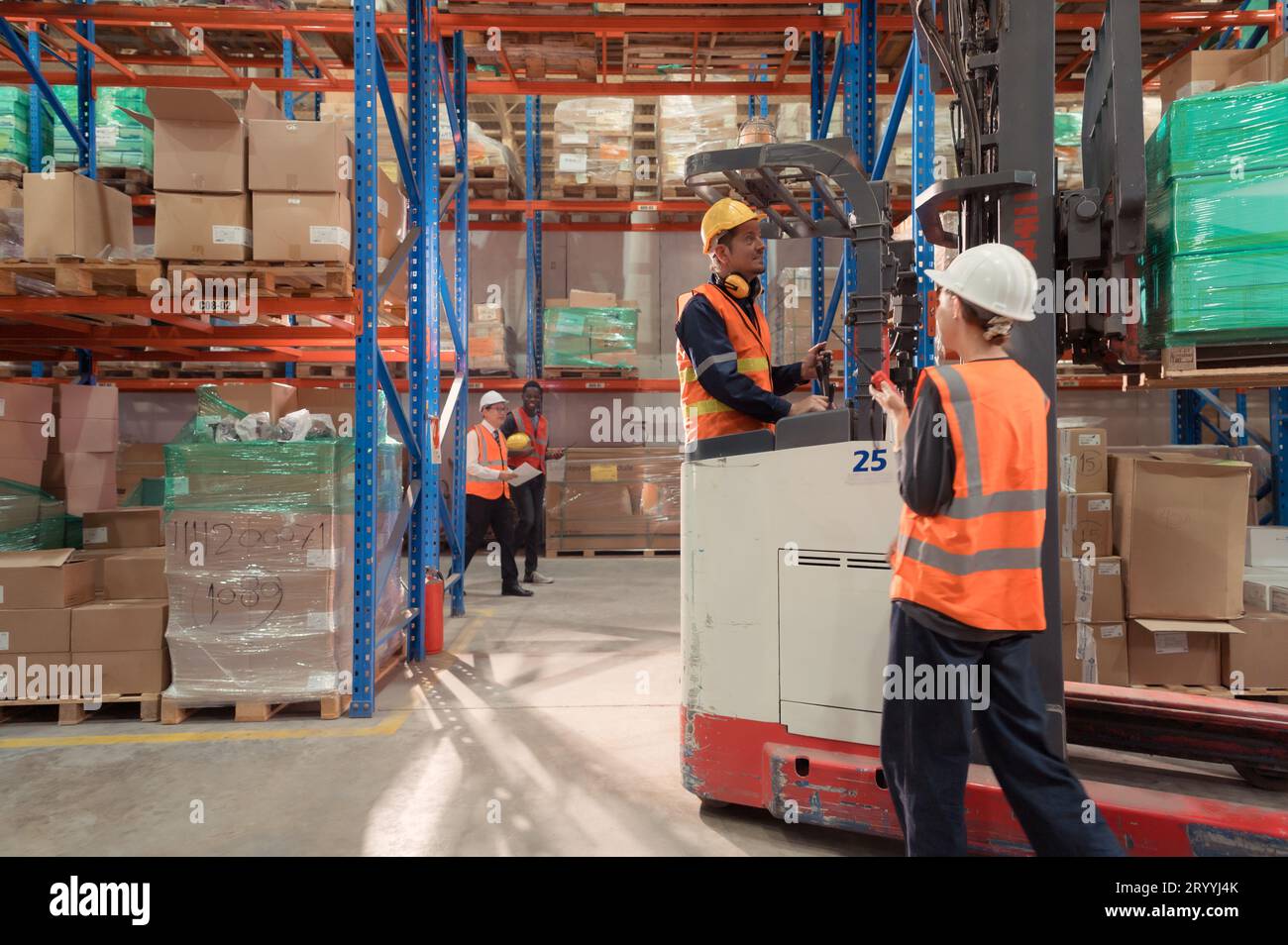 Managers, foremen and warehouse workers Consult together about getting the goods out of the warehouse to finish sending the smal Stock Photo