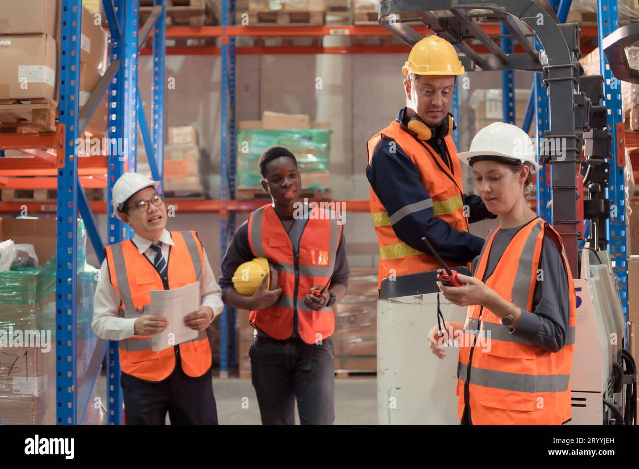 Managers, foremen and warehouse workers Consult together about getting the goods out of the warehouse to finish sending the smal Stock Photo