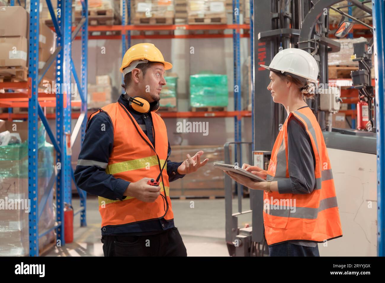 The Manager delivers the report to the foreman and jointly inspects the goods that need to be brought into the central warehouse Stock Photo