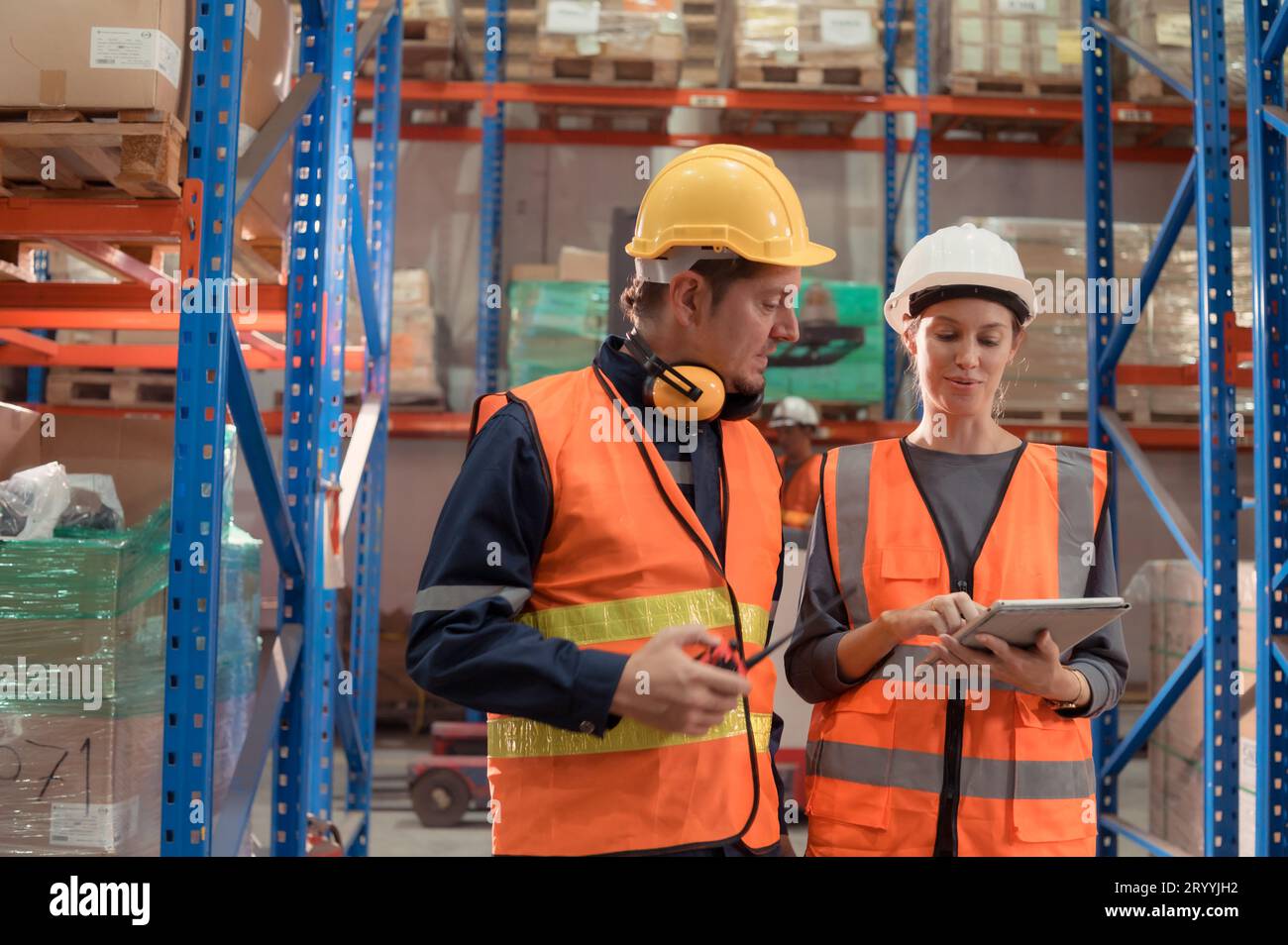 The Manager delivers the report to the foreman and jointly inspects the goods that need to be brought into the central warehouse Stock Photo