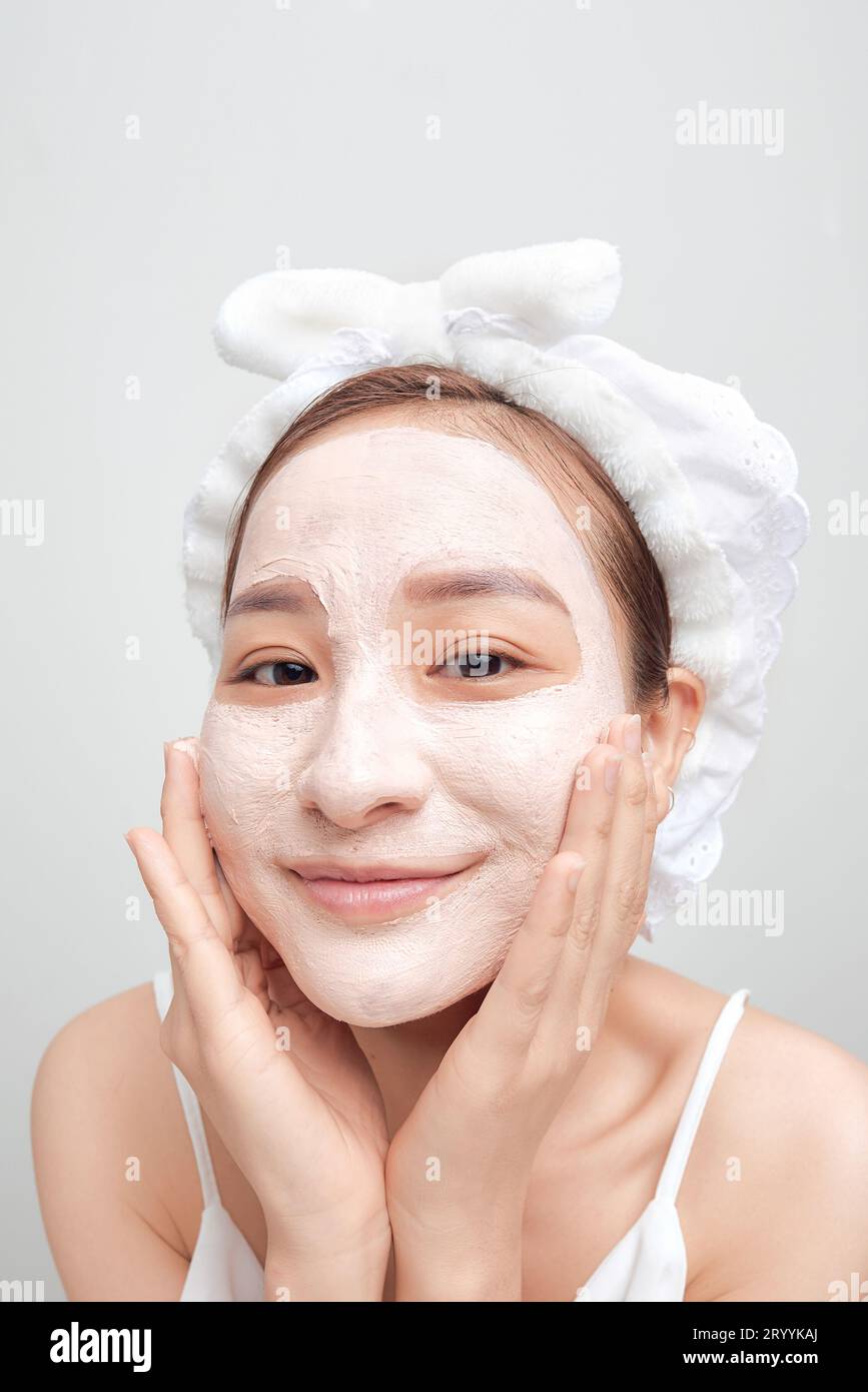 the woman after the shower put a mask on her face Stock Photo Alamy