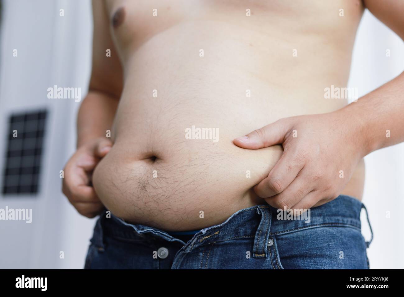 https://c8.alamy.com/comp/2RYYKJ8/man-with-fat-belly-in-dieting-concept-overweight-man-touching-his-fat-belly-and-want-to-lose-weight-2RYYKJ8.jpg