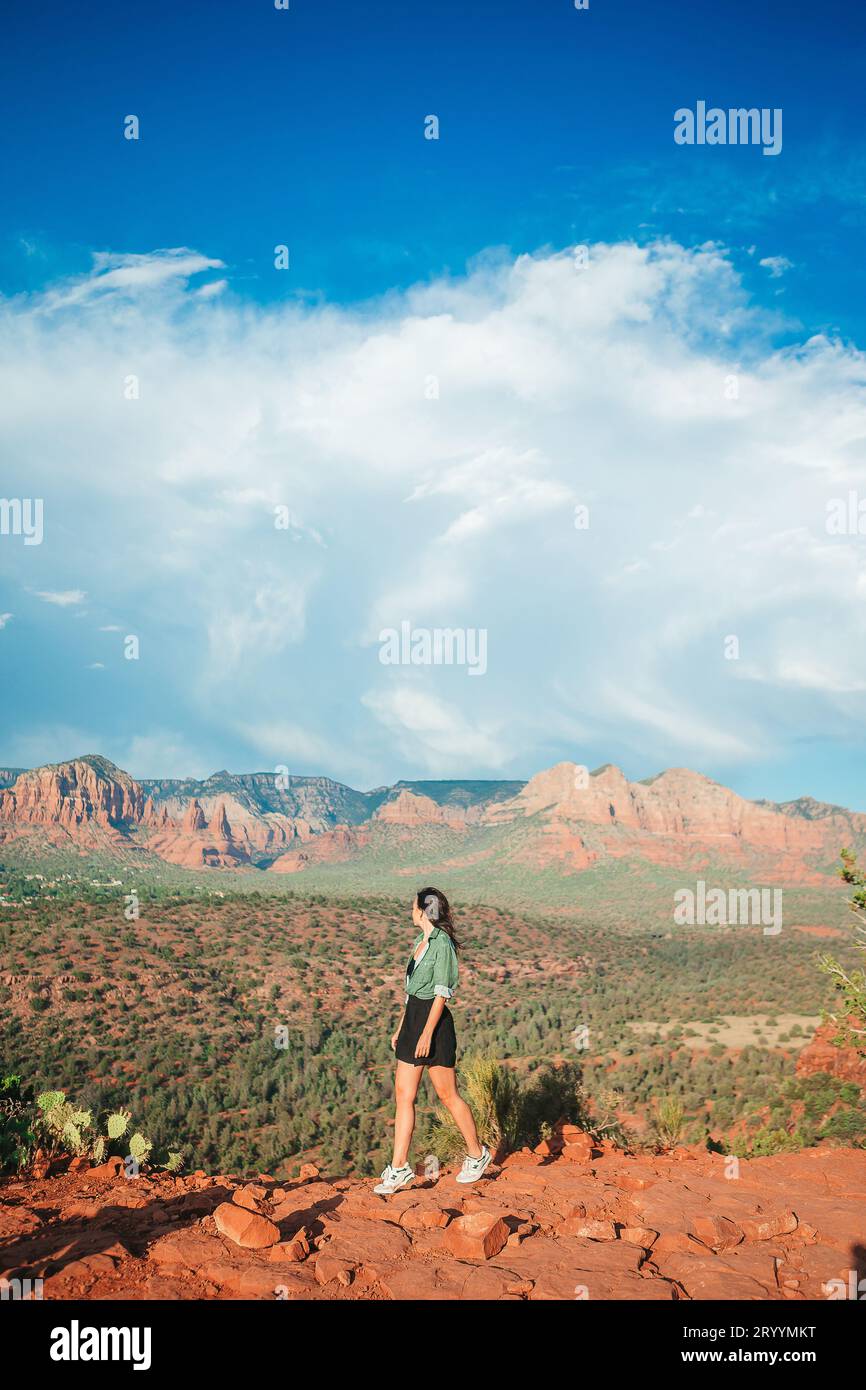 Young hiker woman on the edge of a cliff at Cathedral Rock in Sedona ...