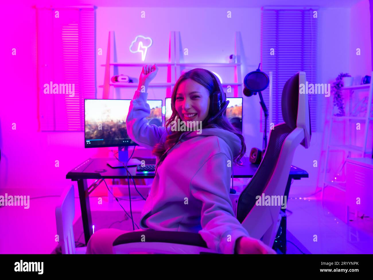 Female gamer celebrating victory hands hi-res stock photography and ...