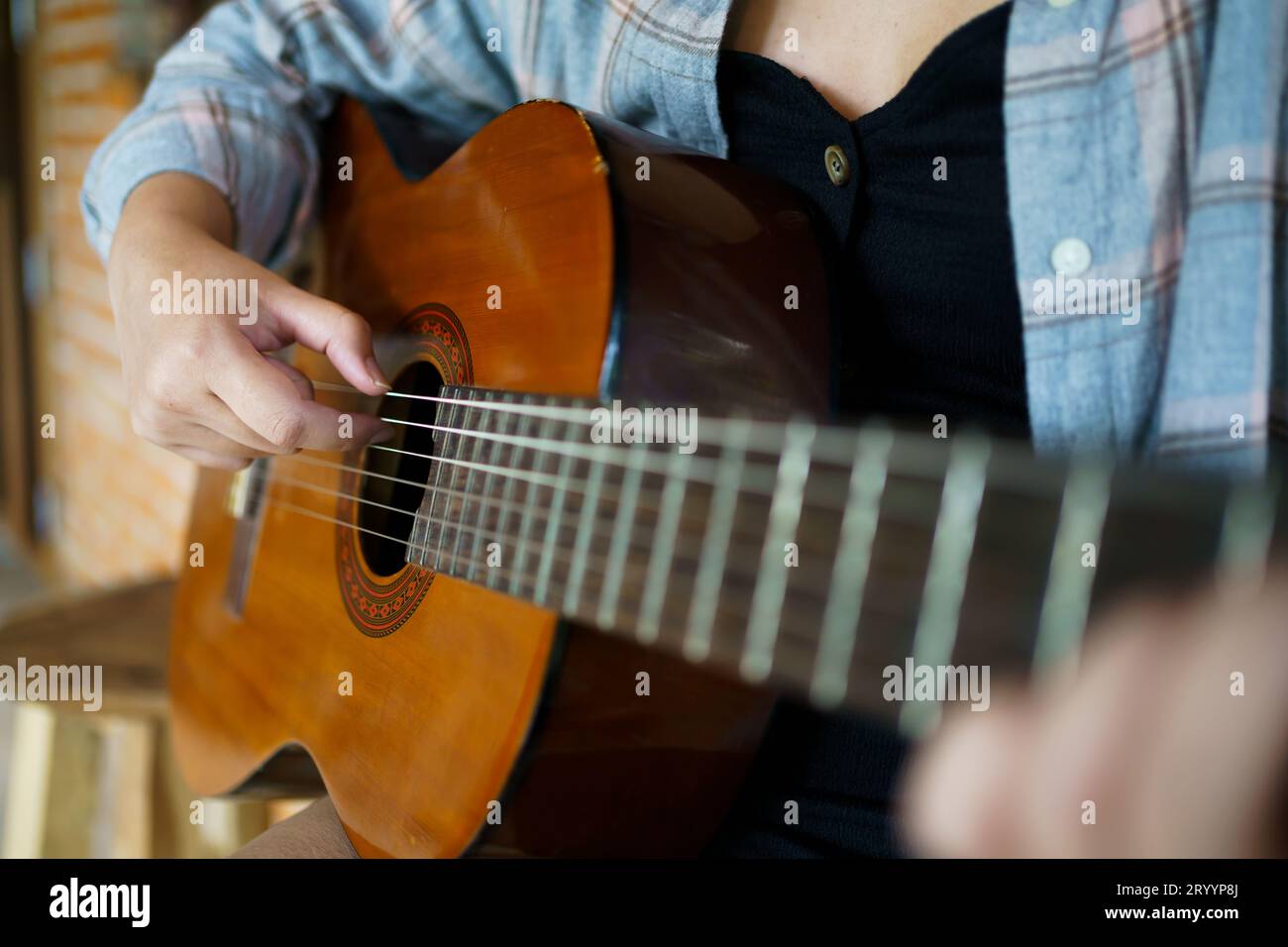 Happy young Woman hands playing acoustic guitar musician Â alone compose instrumental songÂ lesson on playing the guitar Stock Photo