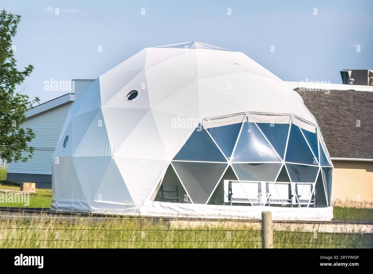 A Bubble Tent Dome House Camping Tent or a Geodome outdoor classroom for co-curricular classes and clubs. Stock Photo