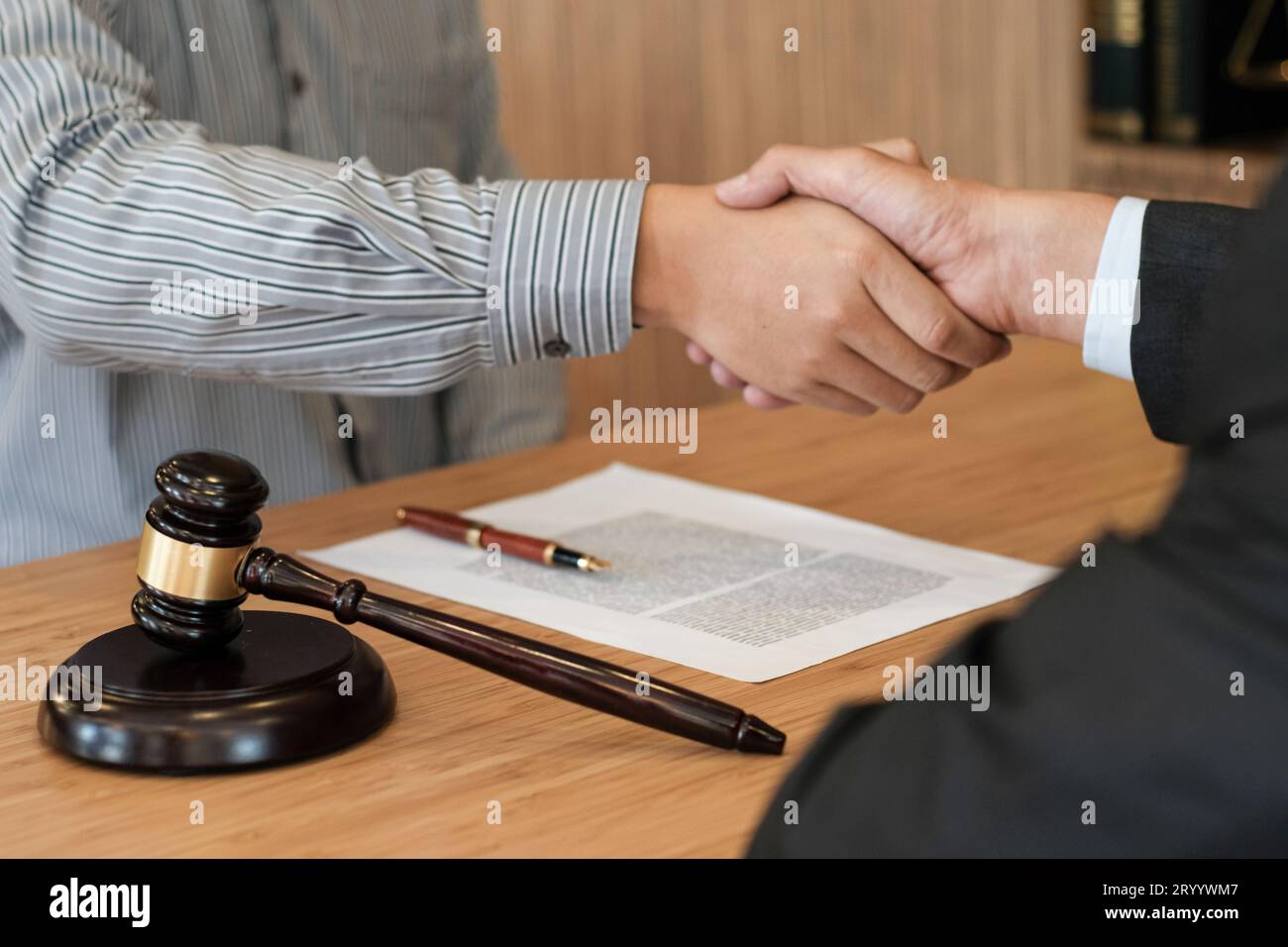 Female lawyer handshake with client. Business partnership meeting successful concept. Stock Photo