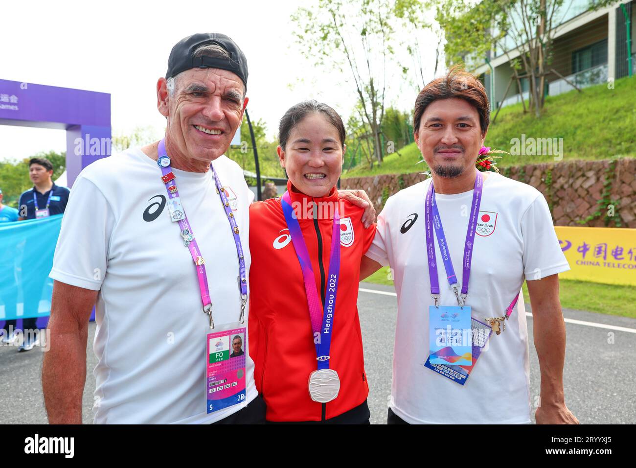 (L-R) Daniel Gisiger/(Team Japan Coach), Eri Yonamine/(JPN), Yugo Anada/(Team Japan Trainer) on photo session during The 19th Asian Games, Cycling Women's Individual Time Trial at Chun'an Jieshou Sports Centre Road Course, China, October 3, 2023. Credit: Kenichi Inomata/AFLO/Alamy Live News Stock Photo