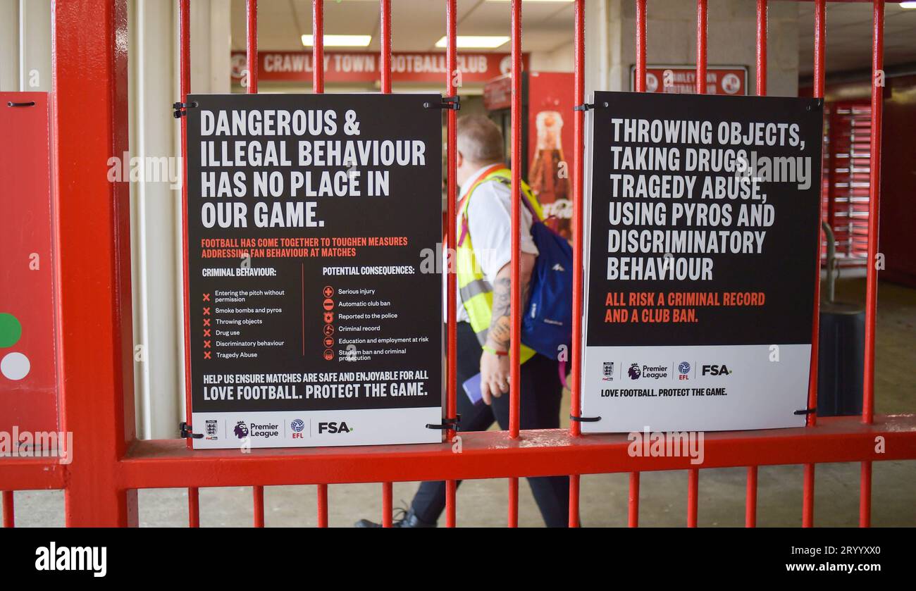 Posters around the stadium warning fans about bad behaviour after recent games where flares and objects have been thrown onto the pitch at the Sky Bet EFL League Two match between Crawley Town and Sutton United at the Broadfield Stadium  , Crawley , UK - 30th September 2023. Photo Simon Dack / Telephoto Images. Editorial use only. No merchandising. For Football images FA and Premier League restrictions apply inc. no internet/mobile usage without FAPL license - for details contact Football Dataco Stock Photo
