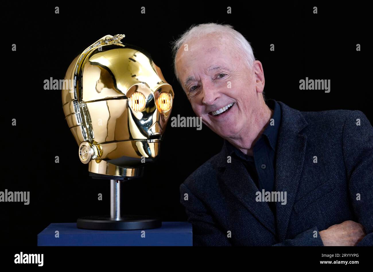 Anthony Daniels poses for a photograph with a screen matched light-up C-3PO head from the 1977 film 'Star Wars: A New Hope' (estimated £500,000 - 1,000,000) which is part of his personal collection, during a preview for the showbiz memorabilia auction, at the Propstore in Rickmansworth, Hertfordshire. Picture date: Wednesday September 20, 2023. Stock Photo