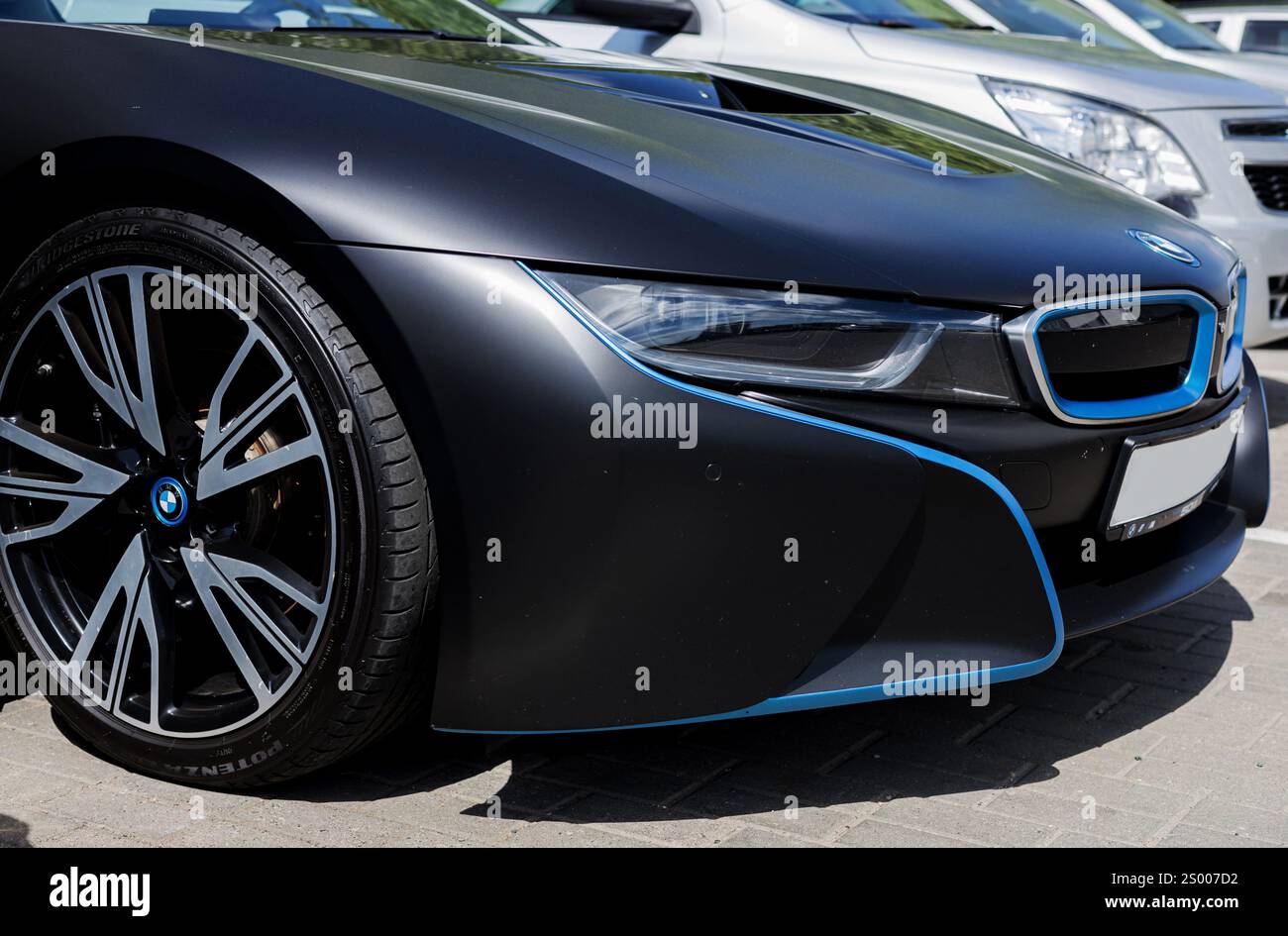 Minsk, Belarus, December 23, 2024 - Wheel and headlight of luxury BMW ...