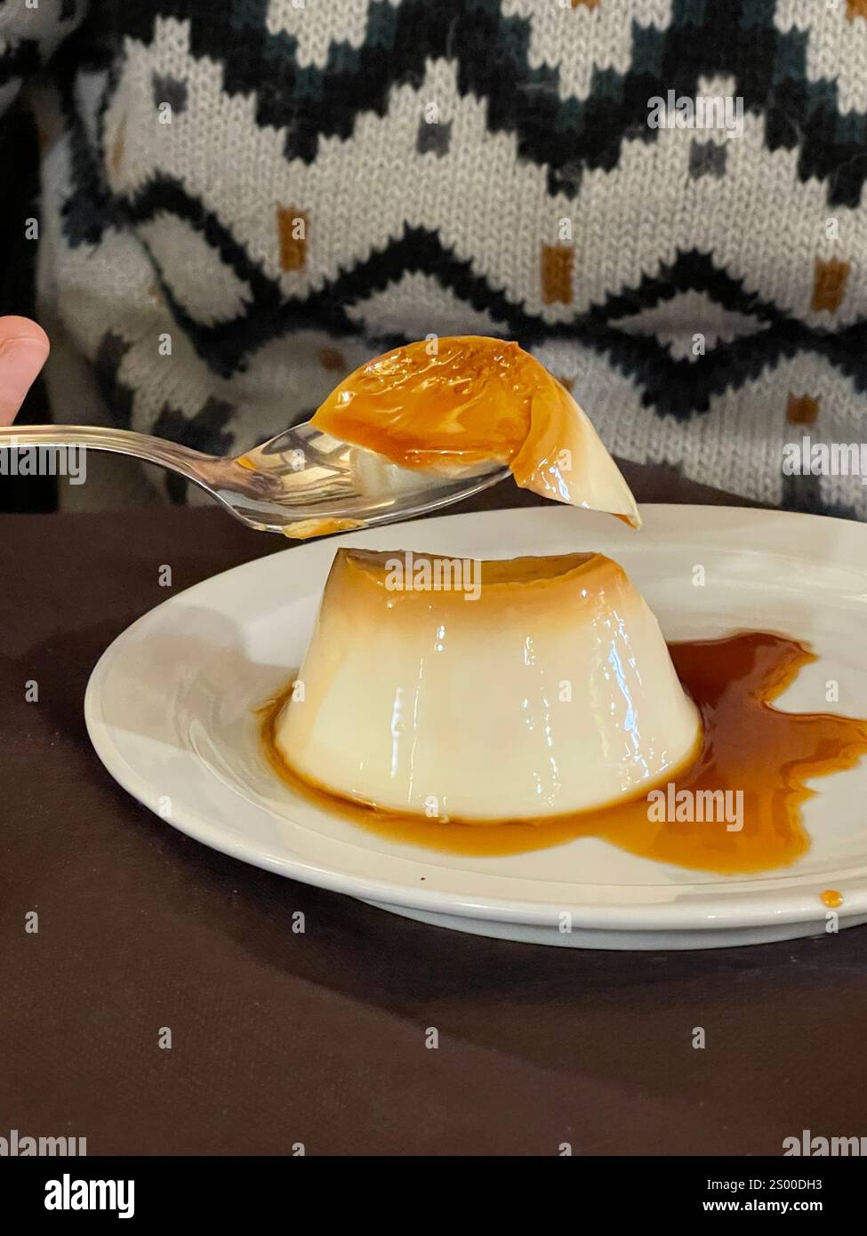 Eating creme caramel. - Smartphone Captured Stock Image