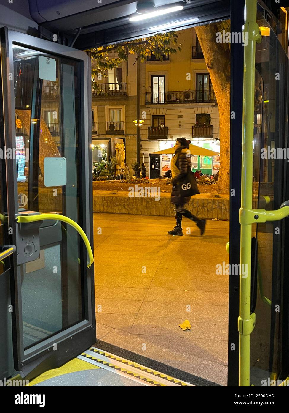 Open door of a bus. Tirso de Molina Square, Madrid, Spain. - Smartphone Captured Stock Image