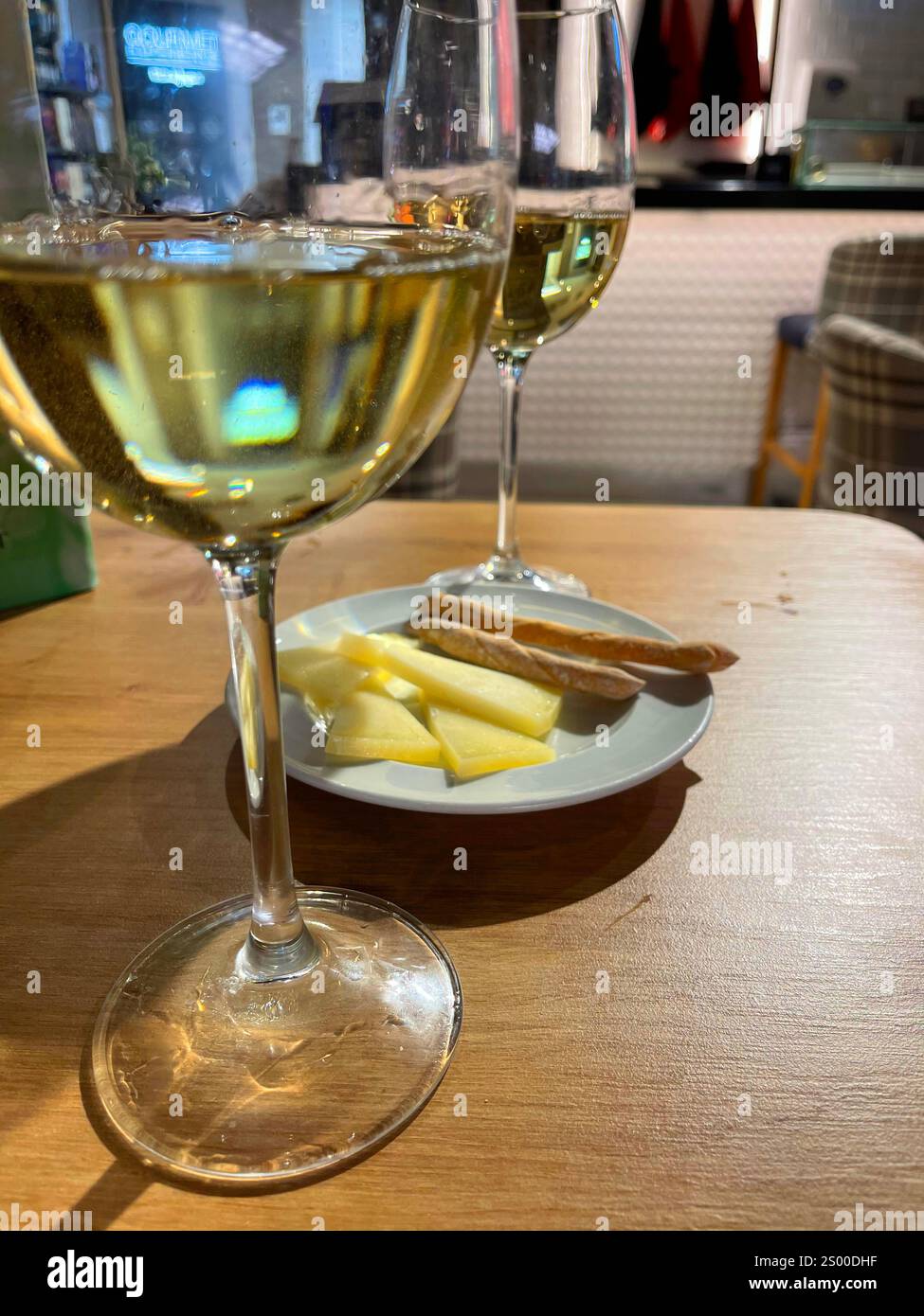 Two glasses of white wine with tapa. Spain. - Smartphone Captured Stock Image