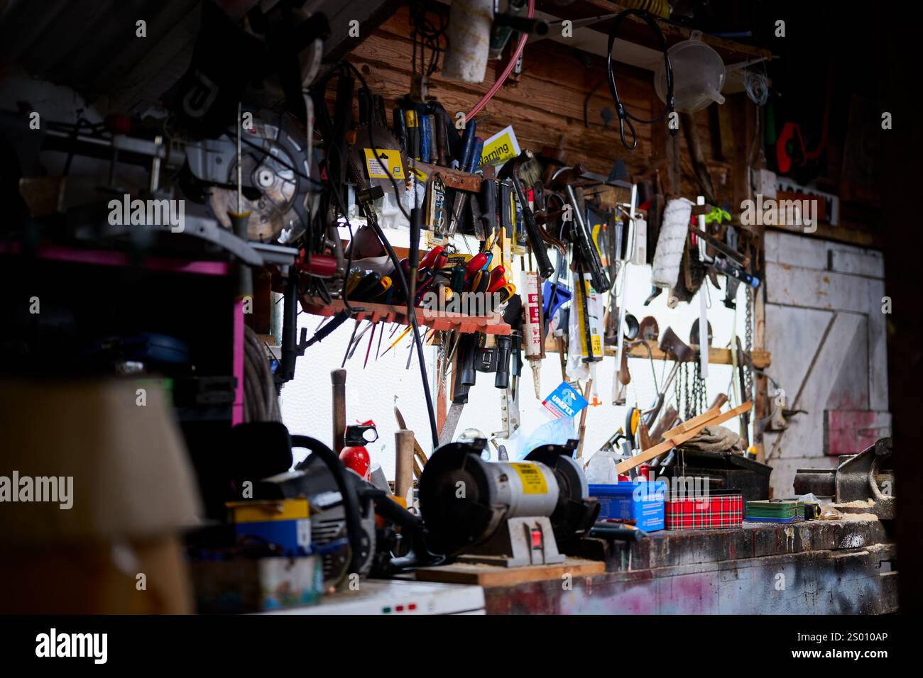 Manchester, UK, 01, December, 2024: A cluttered workshop with tools and ...