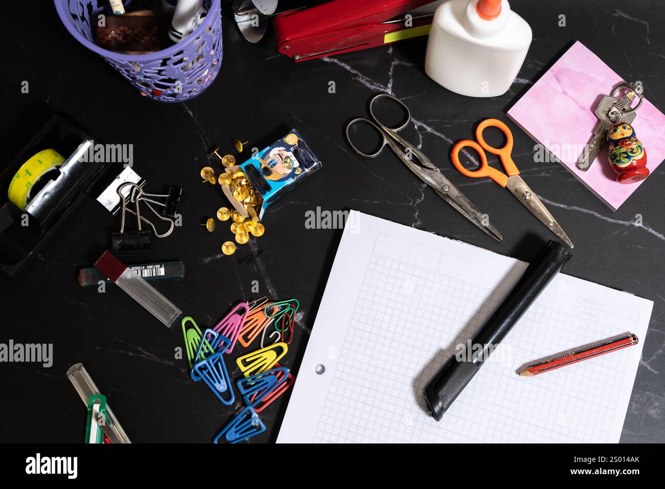 Messy set of office or school stationery items. Office suplies. Aereal ...