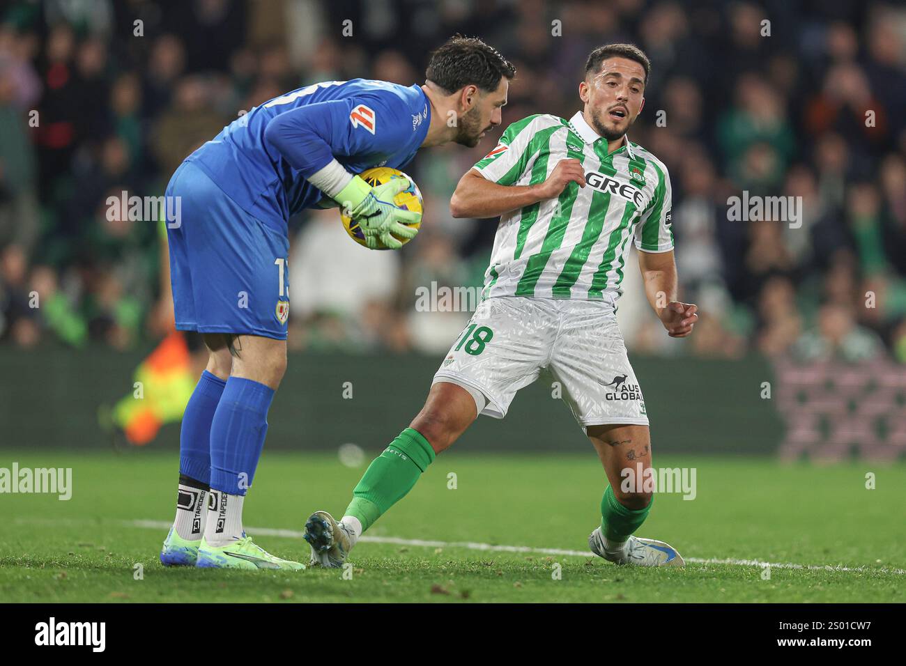 Augusto Batalla of Rayo Vallecano and Pablo Fornals of Real Betis ...