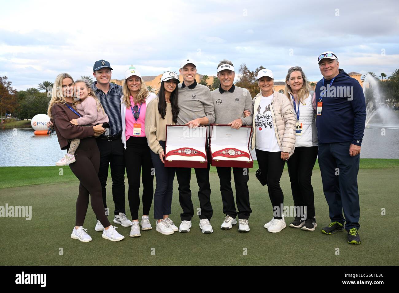 Bernhard Langer, center right, and his son Jason Langer pose with the