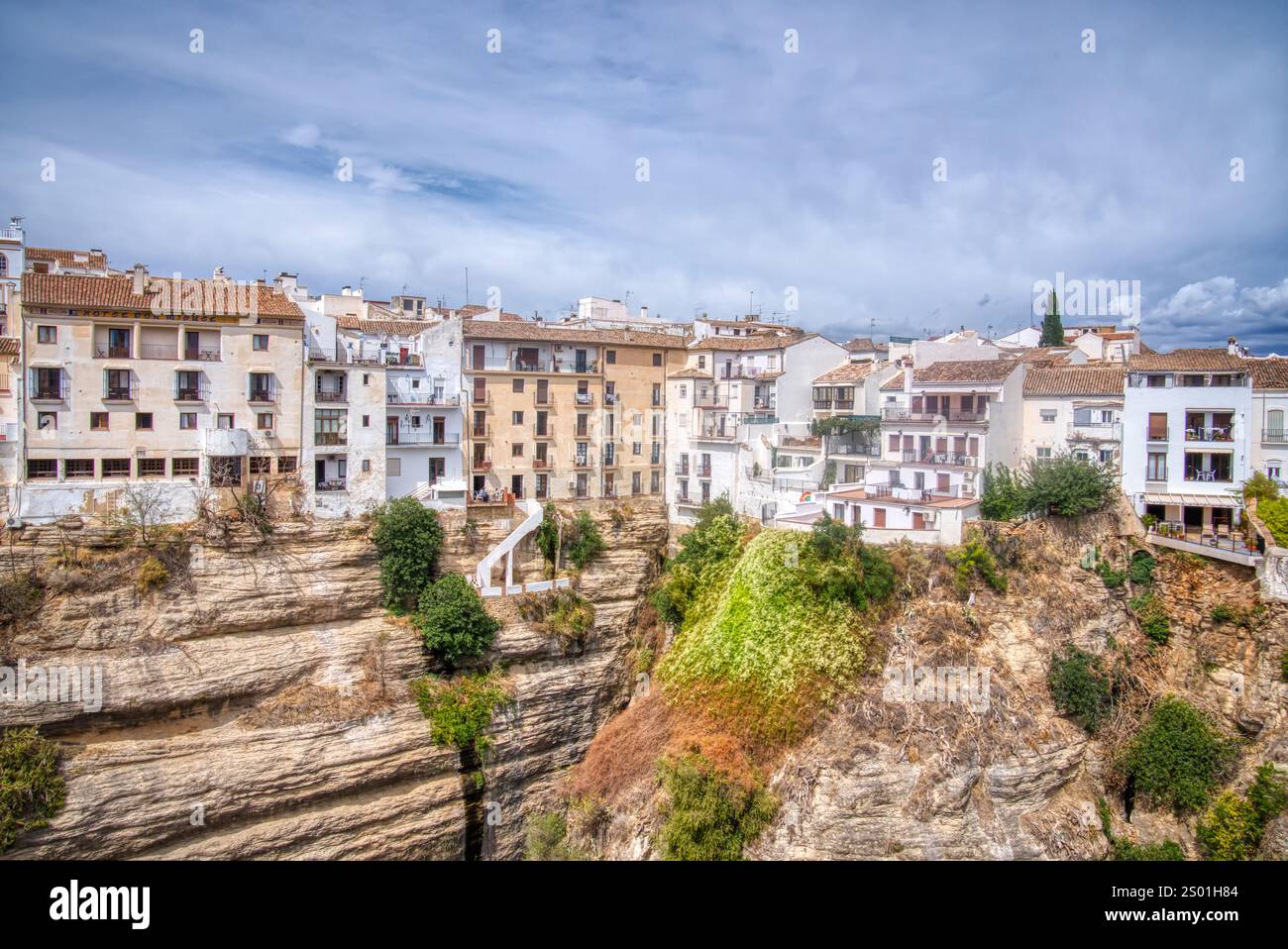 The historic mountaintop village of Ronda in the Malaga Province of Andalusia is one of the most visited villages in Spain. Stock Photo
