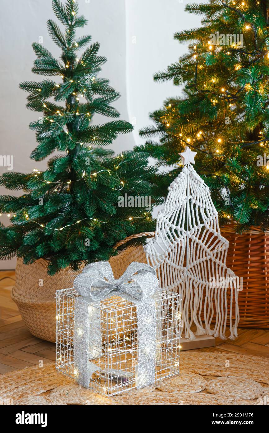 Festive holiday decorations with Christmas trees and a wrapped gift in ...