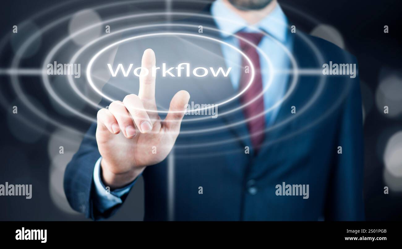Businessman is pressing button on touch screen interface and selecting workflow. Stock Photo