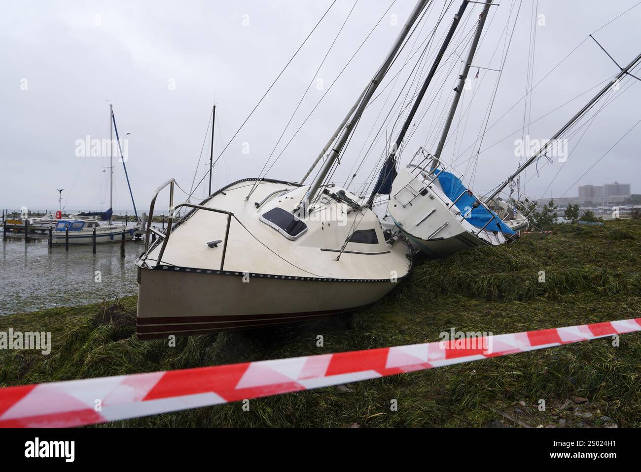 Damaged sailing boats after storm surge in northern Europe Stock Photo ...