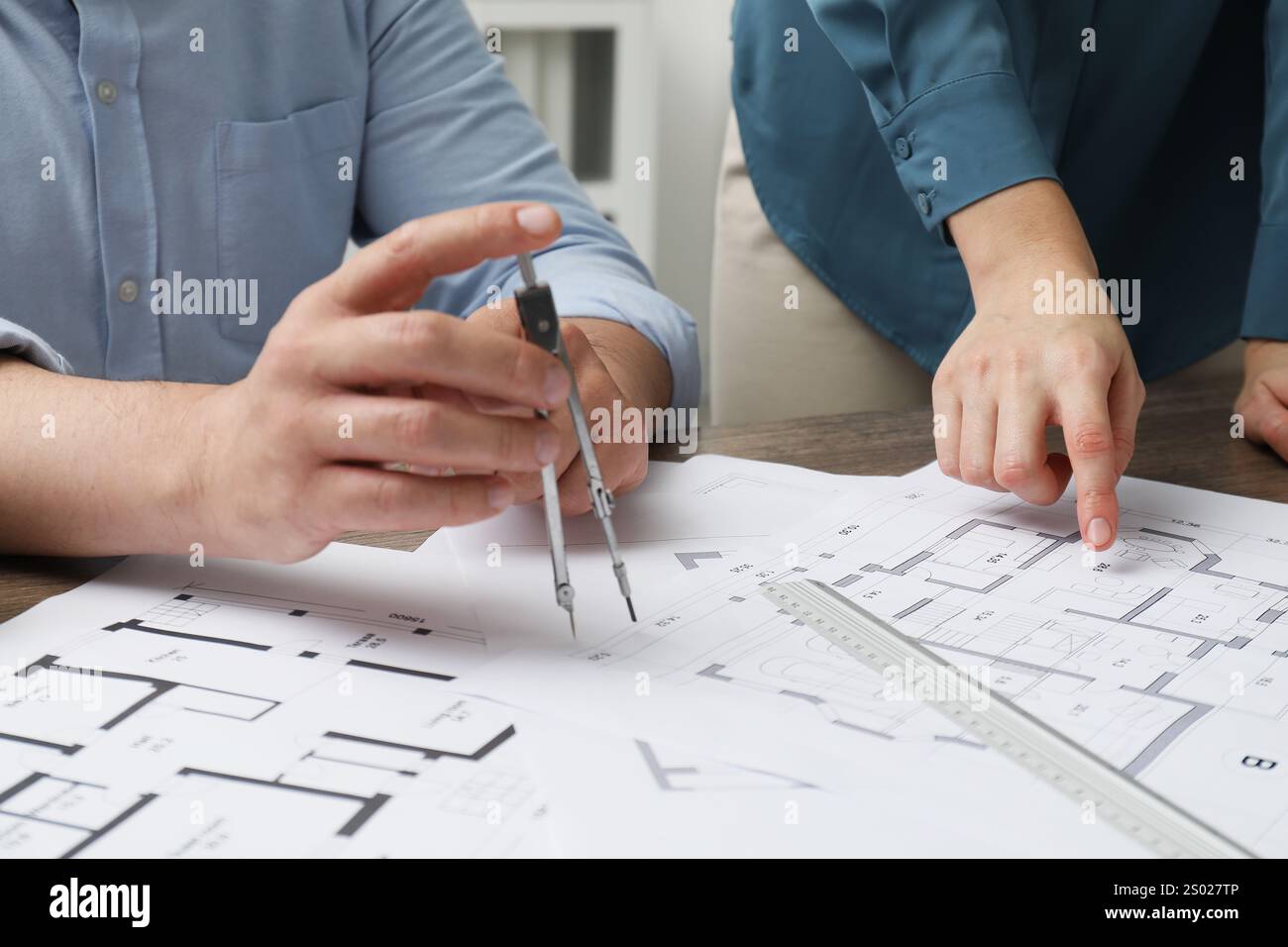 Architects working with project, closeup. Different technical drawings on table Stock Photo
