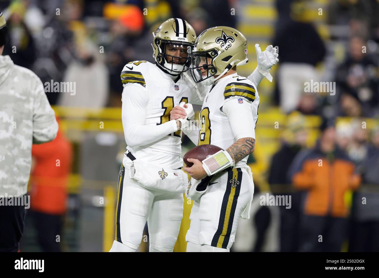 New Orleans Saints quarterback Spencer Rattler, right, greets wide