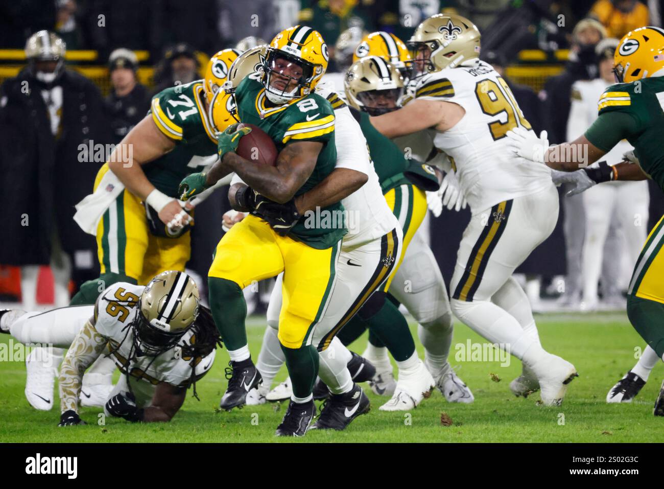 Green Bay Packers running back Josh Jacobs (8) carries during the first
