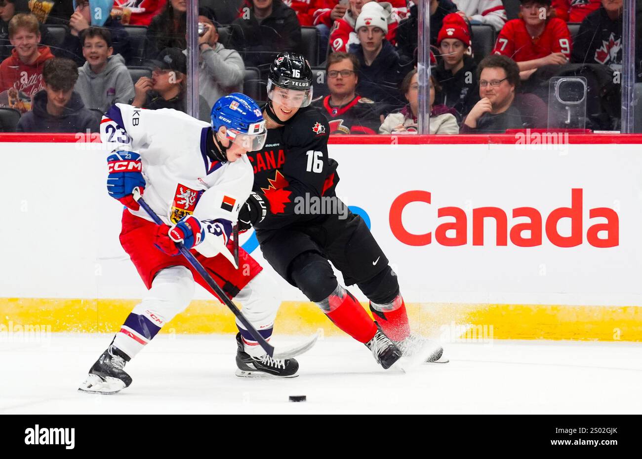 Canada's Carson Rehkopf (16) fights Czechia's Tomas Galvas (23) for the