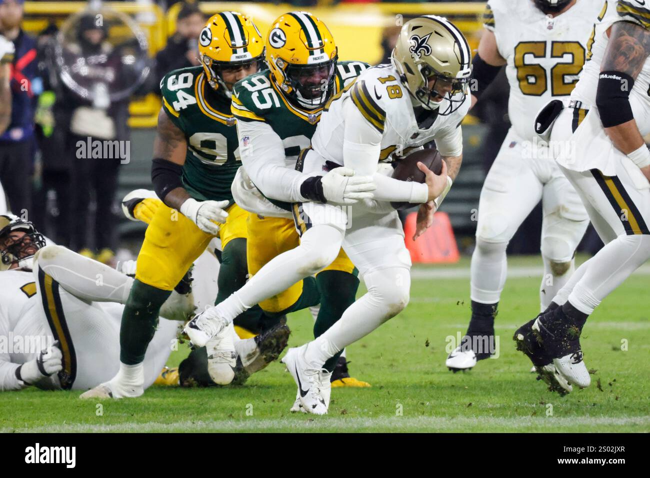 New Orleans Saints quarterback Spencer Rattler (18) is sacked by Green