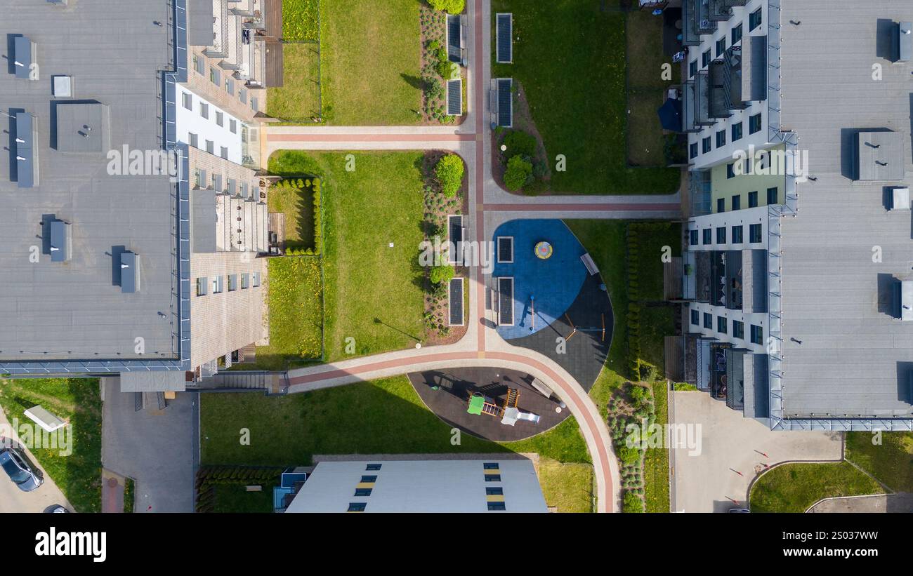 Aerial view of a modern residential complex with green spaces and ...