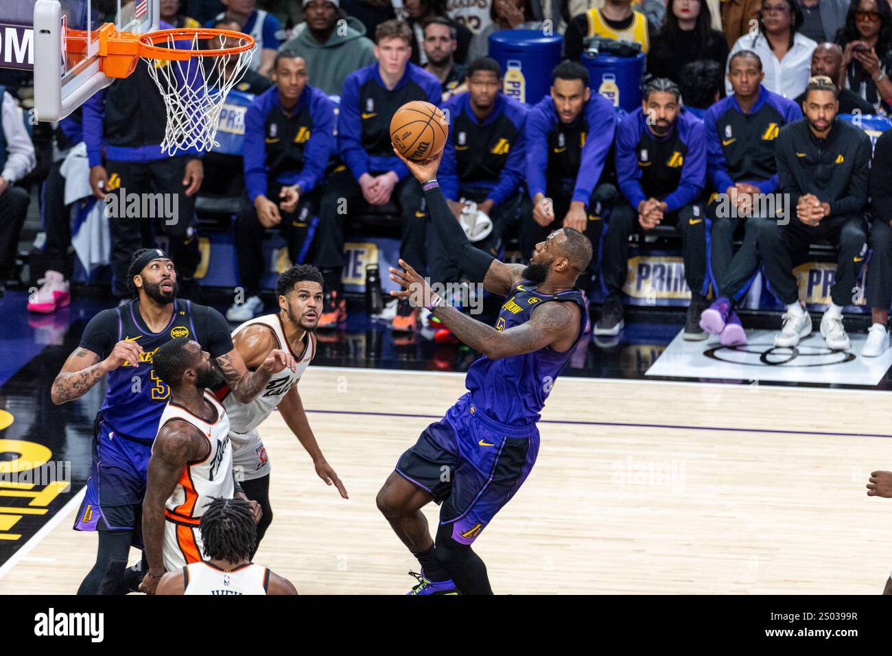 Los Angeles, United States. 23rd Dec, 2024. Los Angeles Lakers' LeBron James (R) goes to the basket against the Detroit Pistons during an NBA basketball game at Crypto.com Arena. Final score; Pistons 117:114 Lakers Credit: SOPA Images Limited/Alamy Live News Stock Photo