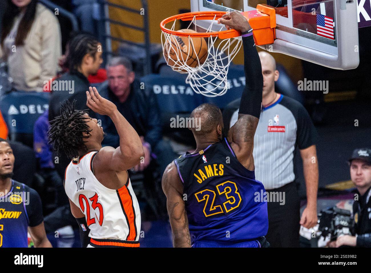 Los Angeles, United States. 23rd Dec, 2024. Los Angeles Lakers' LeBron James #23 dunks against Detroit Pistons' Jaden Ivey #23 during an NBA basketball game at Crypto.com Arena. Final score; Pistons 117:114 Lakers Credit: SOPA Images Limited/Alamy Live News Stock Photo