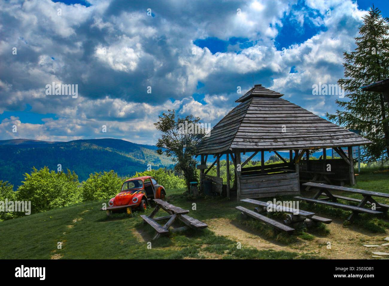 Mountain landscape - panorama of mountains, mountain shelter in the Silesian Beskids, Telesforówka, wreck of an old abandoned car as an attraction for Stock Photo
