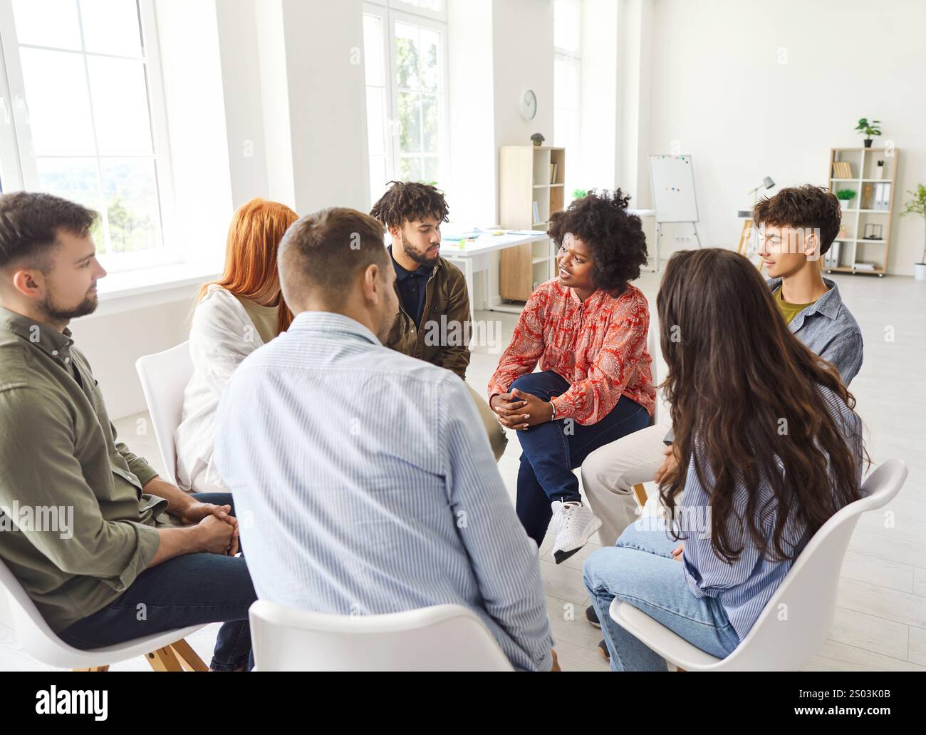 Diverse Group Of People Talking While Sitting In A Circle During A ...