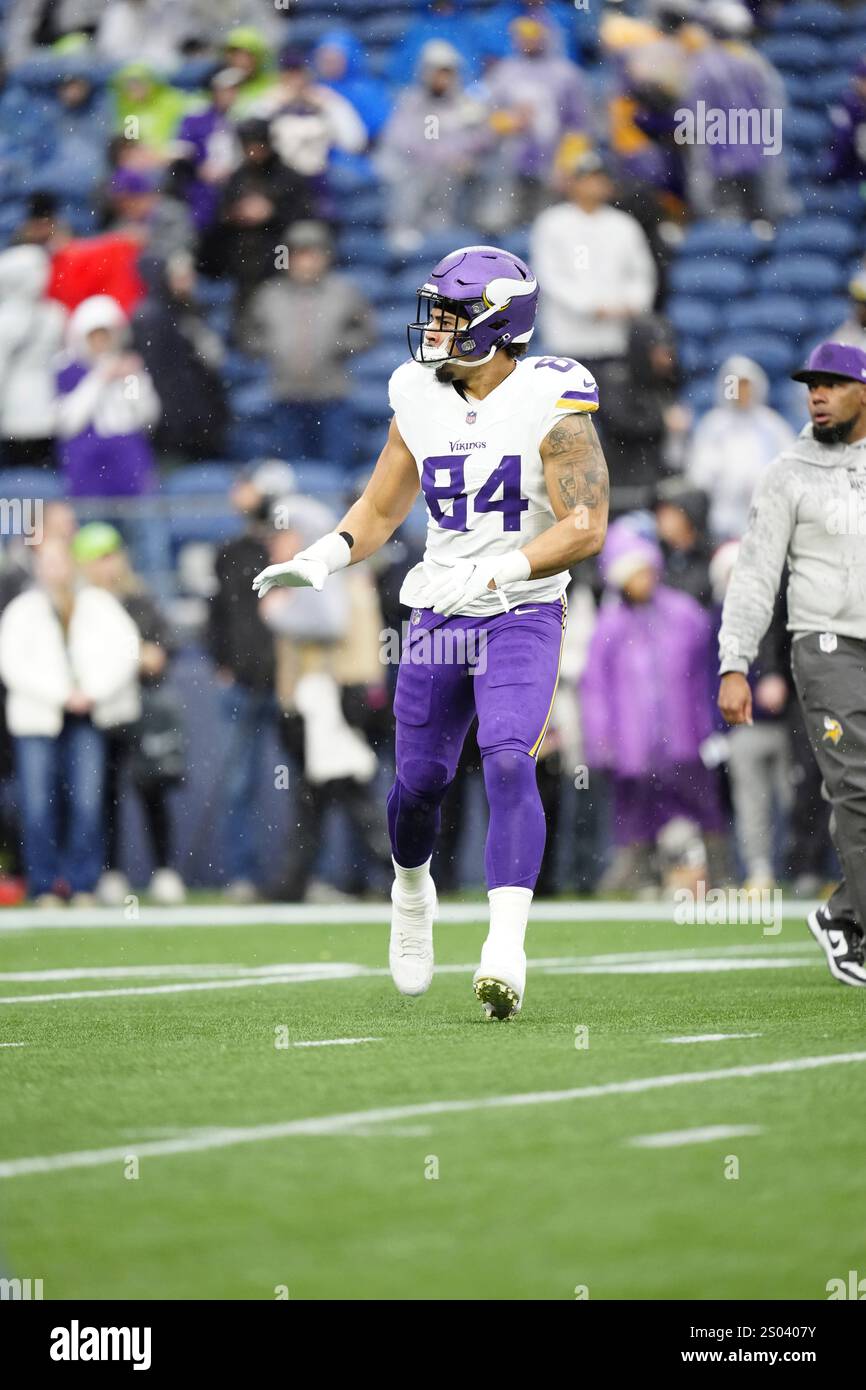 Minnesota Vikings tight end Josh Oliver (84) looks on before an NFL