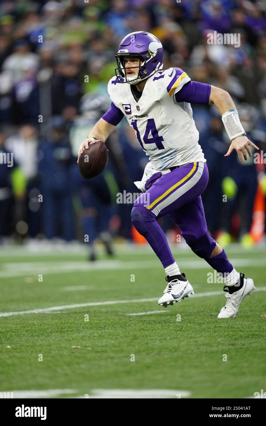 Minnesota Vikings quarterback Sam Darnold (14) runs with the ball