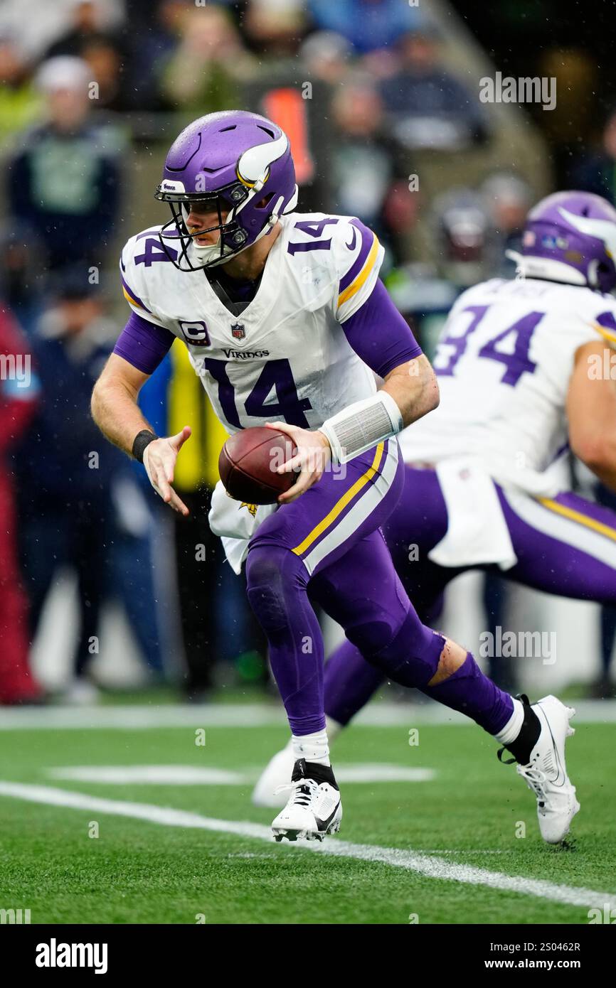 Minnesota Vikings quarterback Sam Darnold (14) hands off the ball