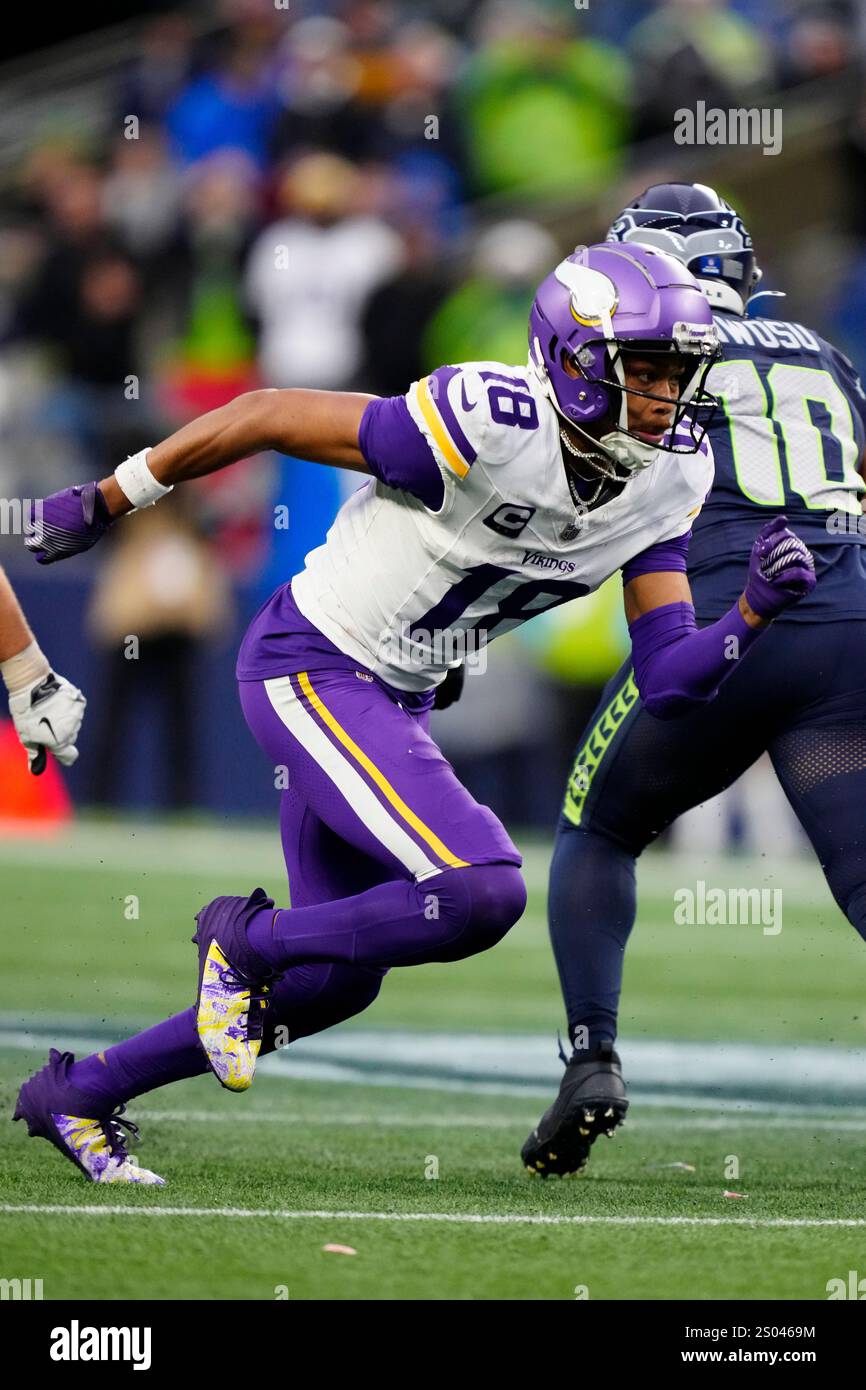Minnesota Vikings wide receiver Justin Jefferson (18) runs down the