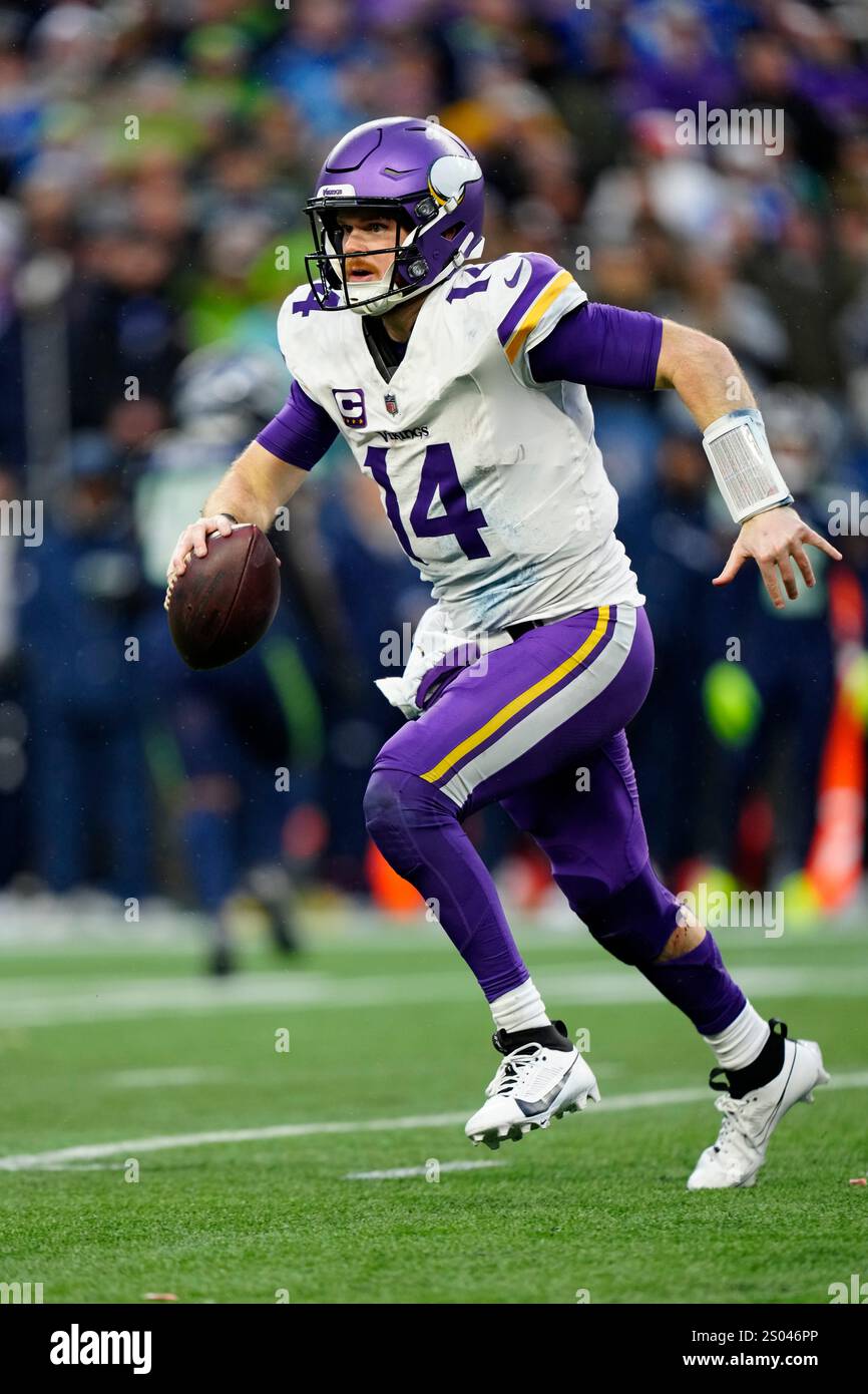 Minnesota Vikings quarterback Sam Darnold (14) runs with the ball