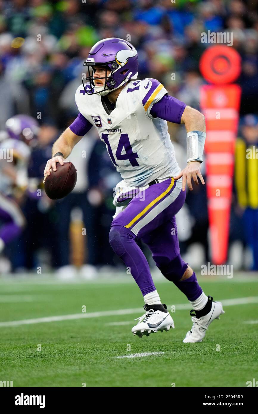 Minnesota Vikings quarterback Sam Darnold (14) runs with the ball