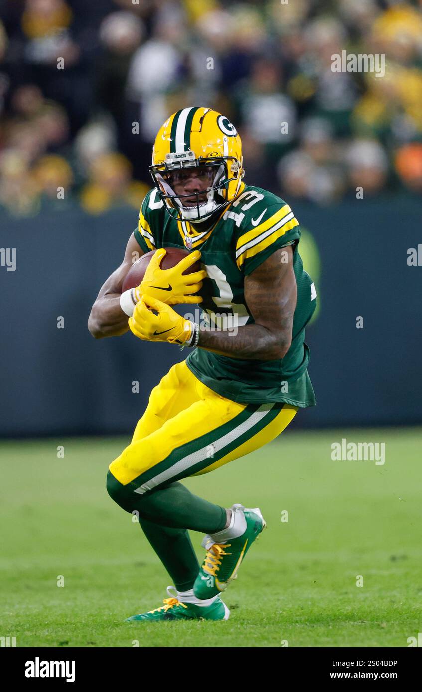 Green Bay Packers wide receiver Dontayvion Wicks (13) runs with the