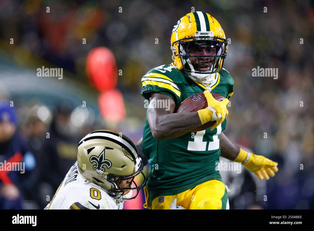 Green Bay Packers wide receiver Jayden Reed (11) runs with the ball