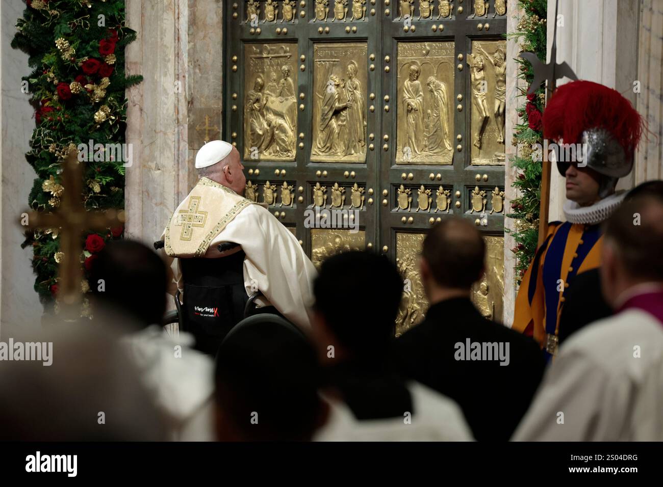 Pope Francis opens the Holy Door to mark the opening of the 2025