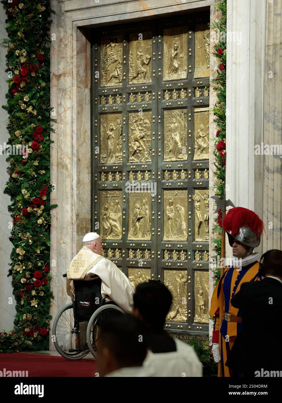 Pope Francis opens the Holy Door to mark the opening of the 2025