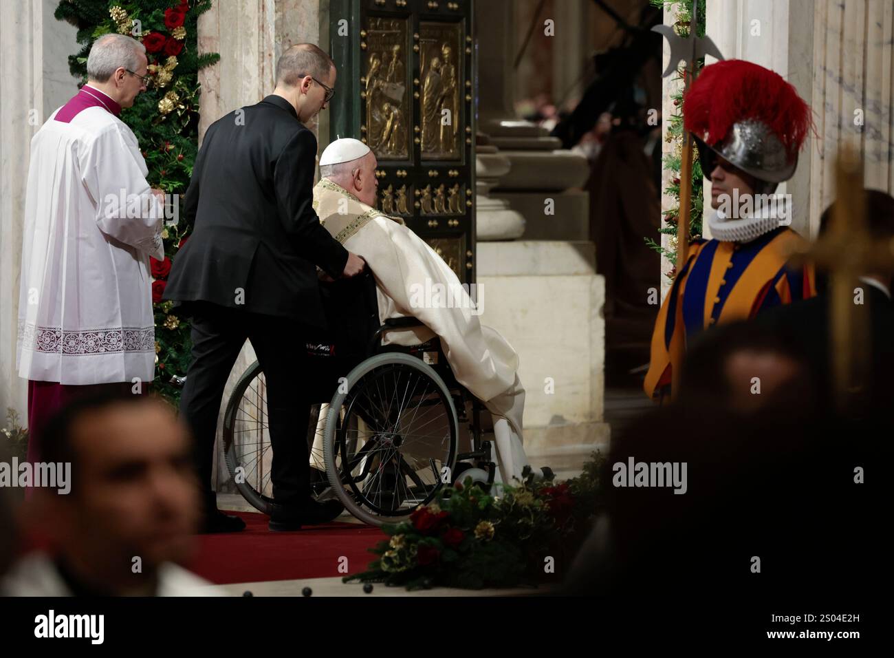 Pope Francis opens the Holy Door to mark the opening of the 2025