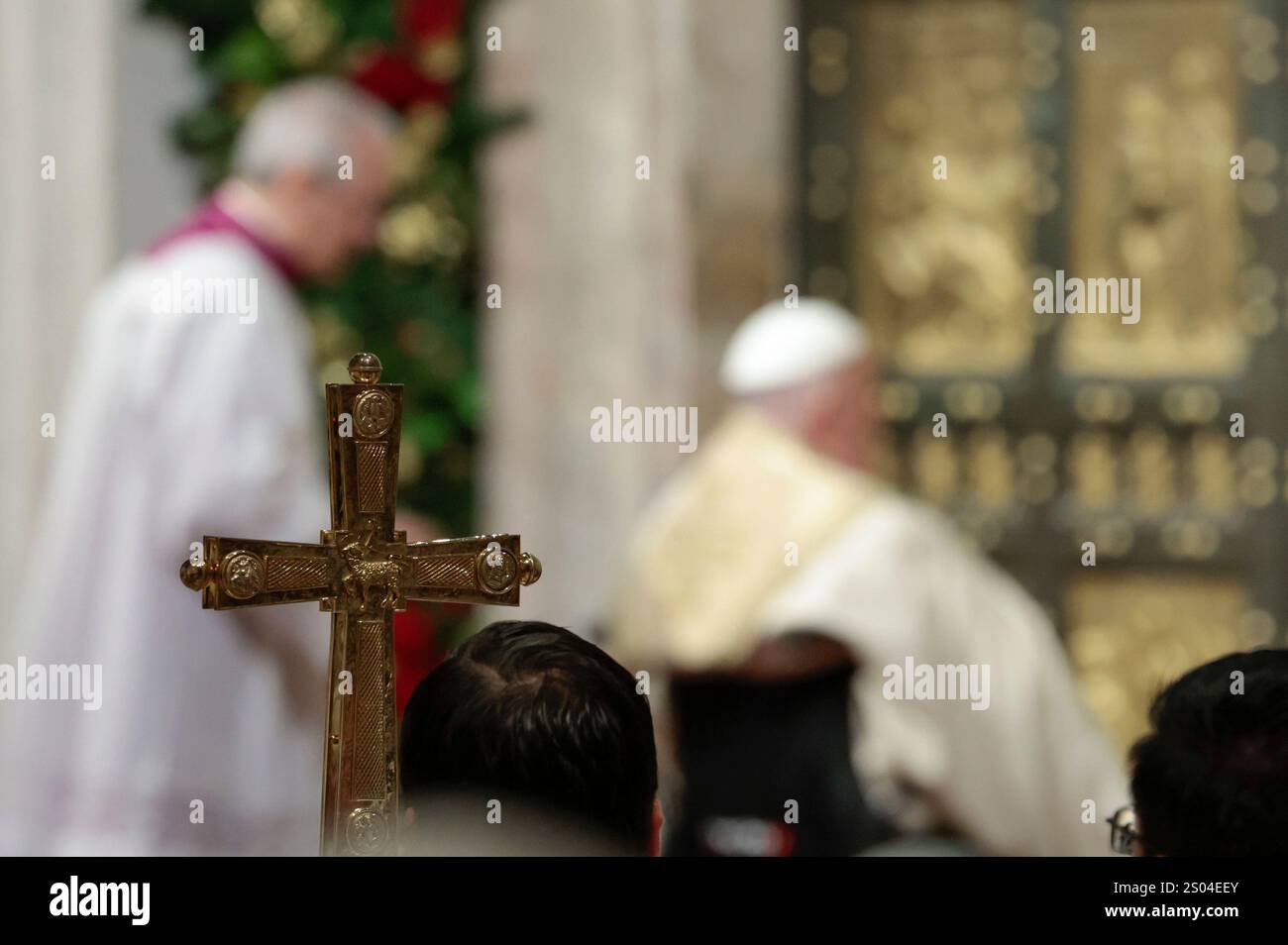 Pope Francis opens the Holy Door to mark the opening of the 2025