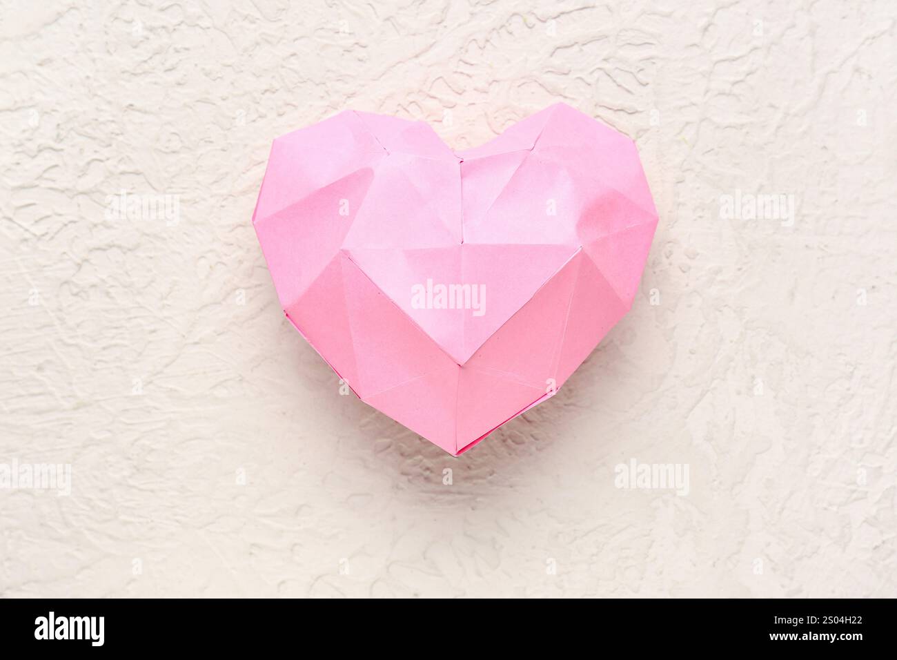 Pink heart made of paper on white background. Valentine's Day ...